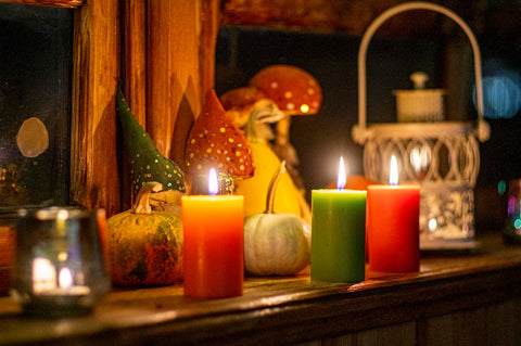 red pillar candles on brown wooden table