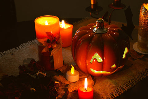 a table topped with lots of lit candles